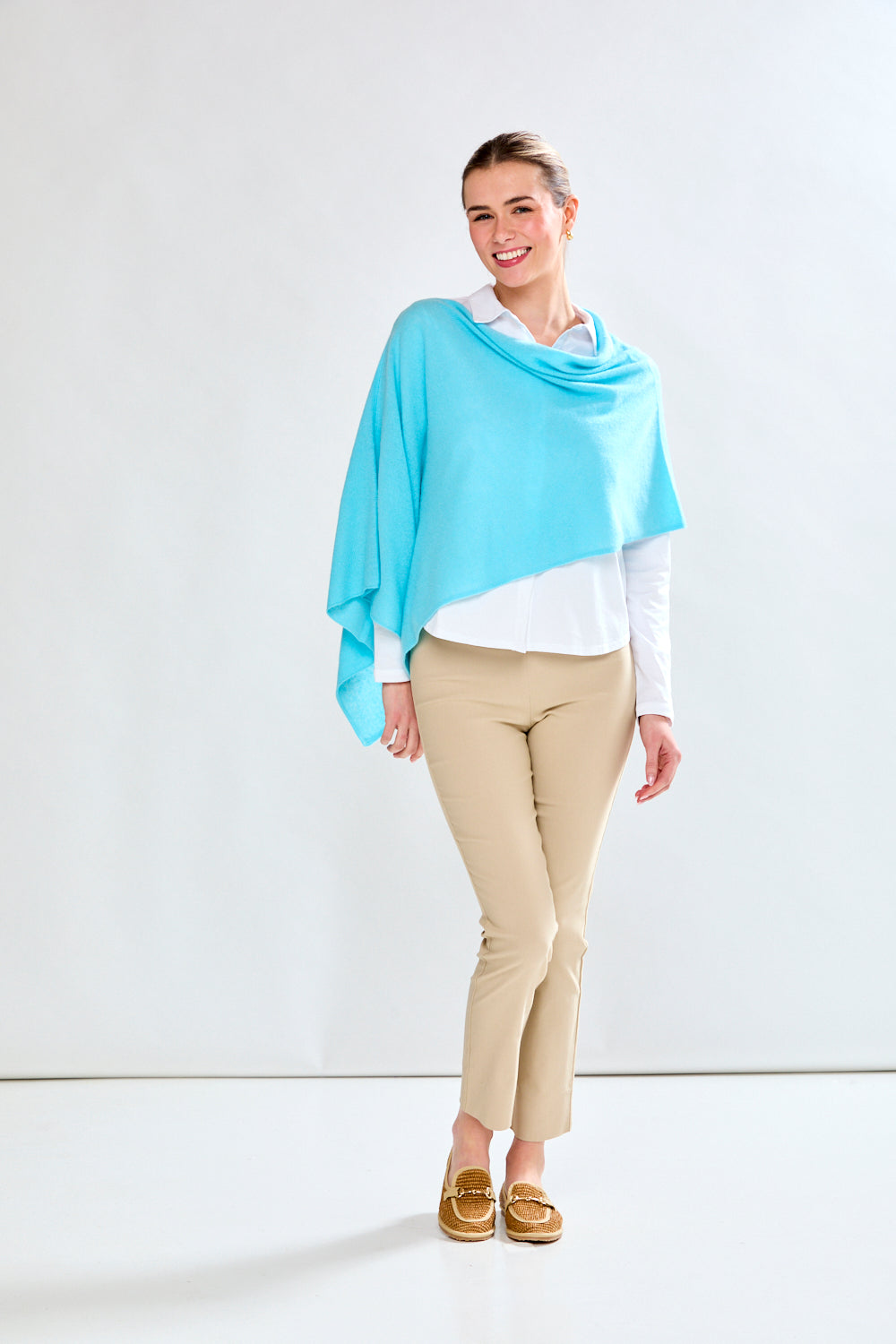 woman in light aqua wrap