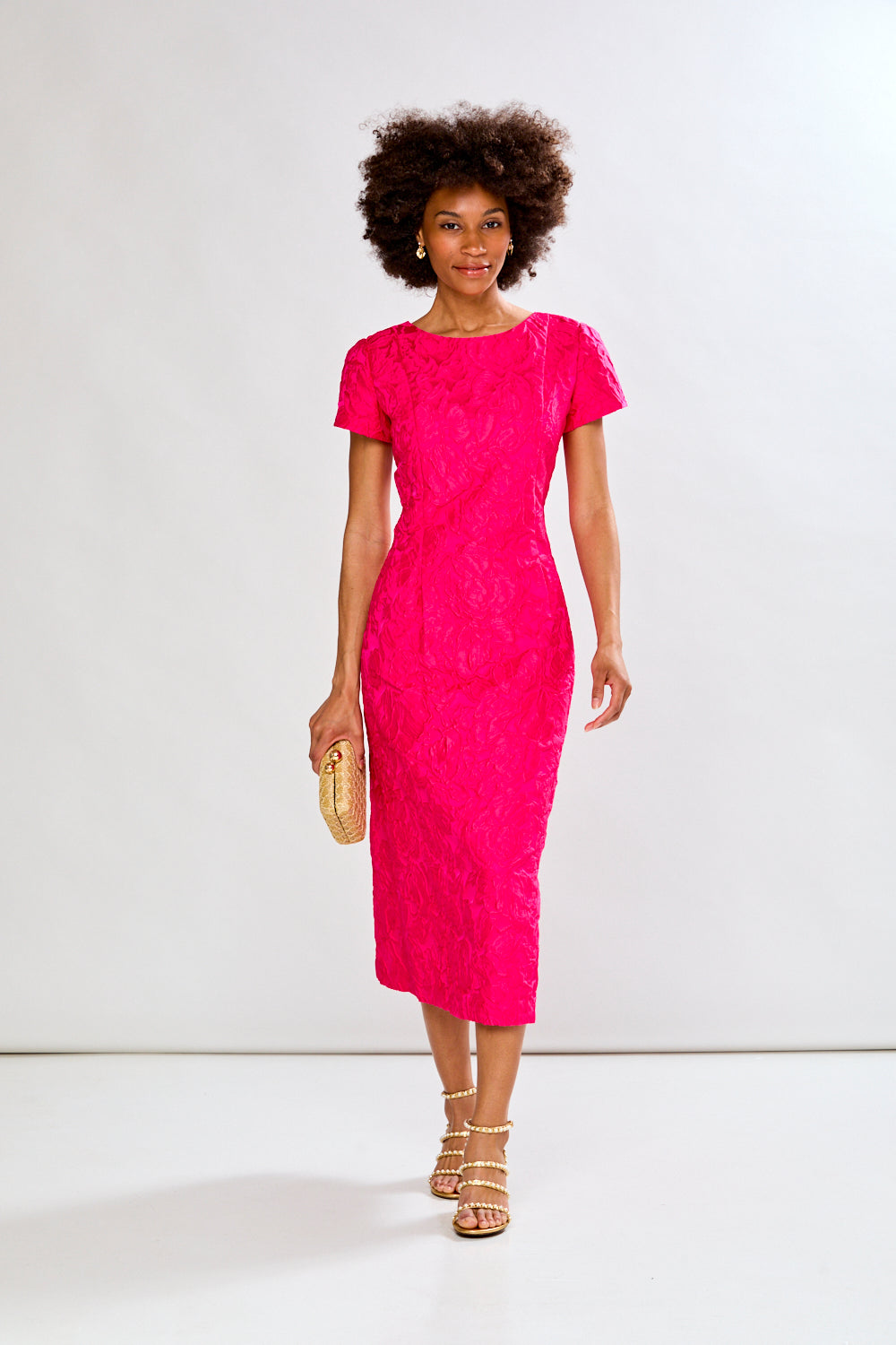 Woman in magenta tea length dress