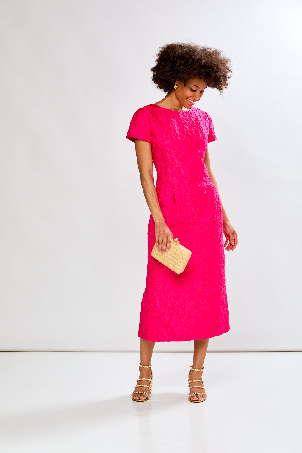 Woman in magenta tea length dress