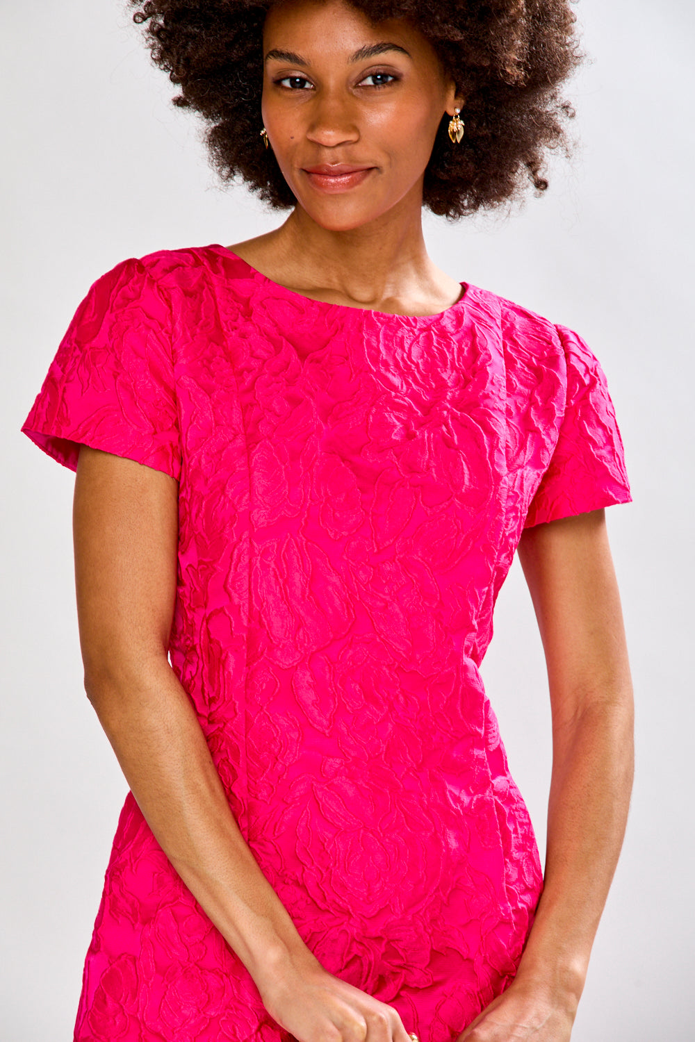 Woman in magenta tea length dress