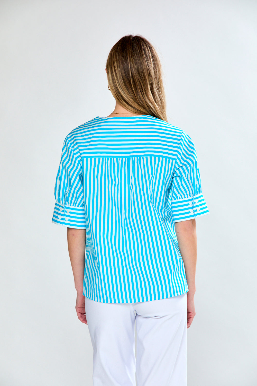 Woman in aqua stripe top