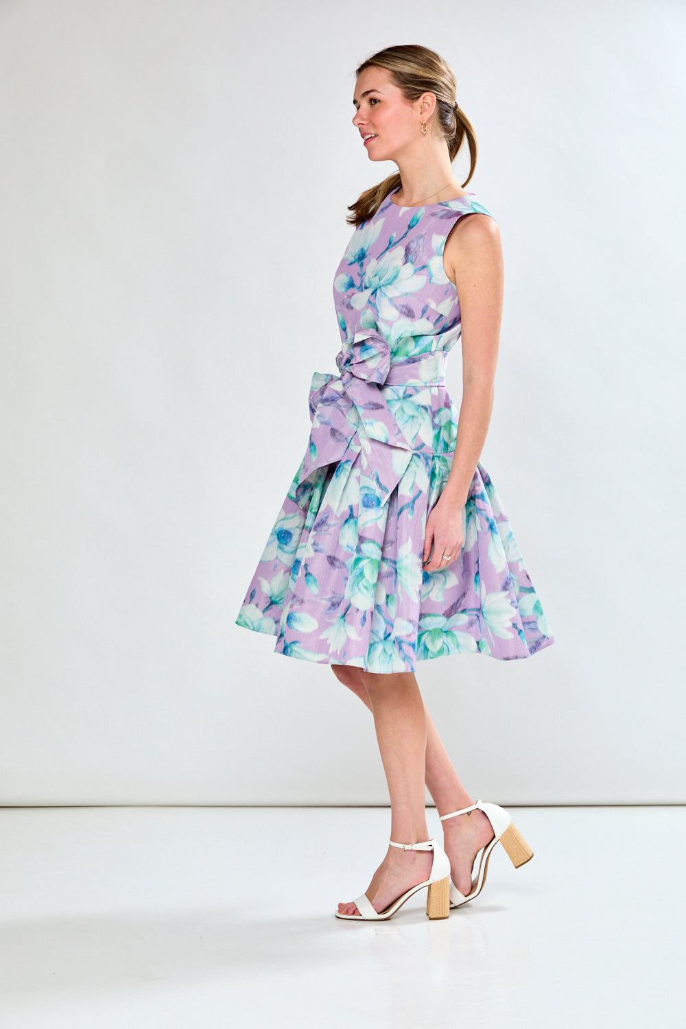 Woman in lilac floral dress