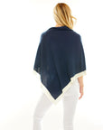 Woman in navy poncho