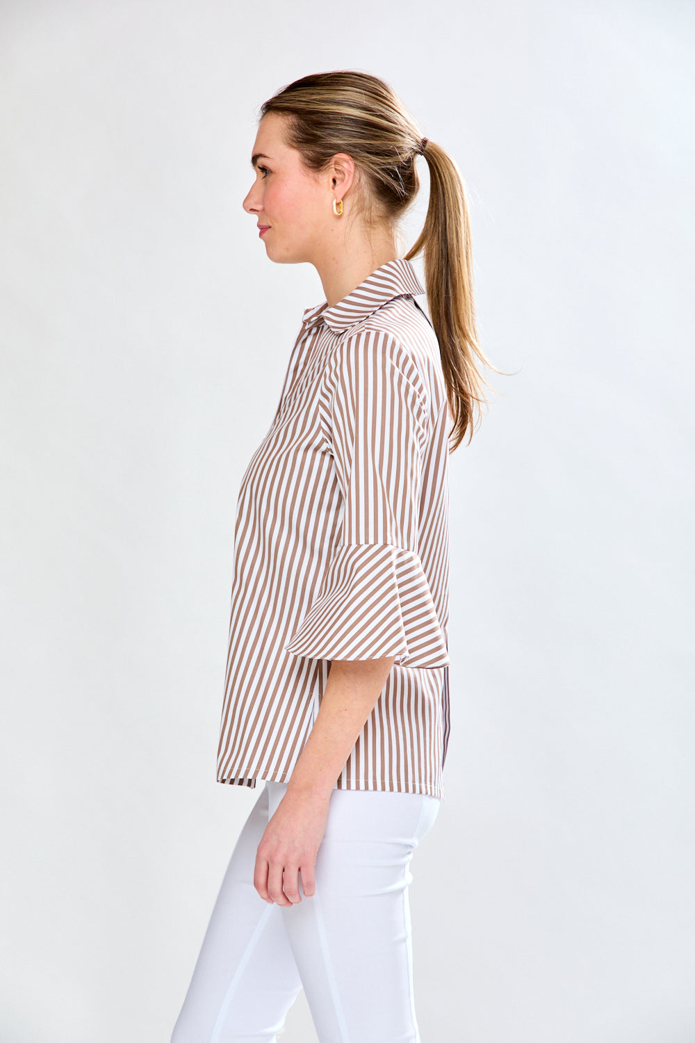 Woman in mocha and white striped top