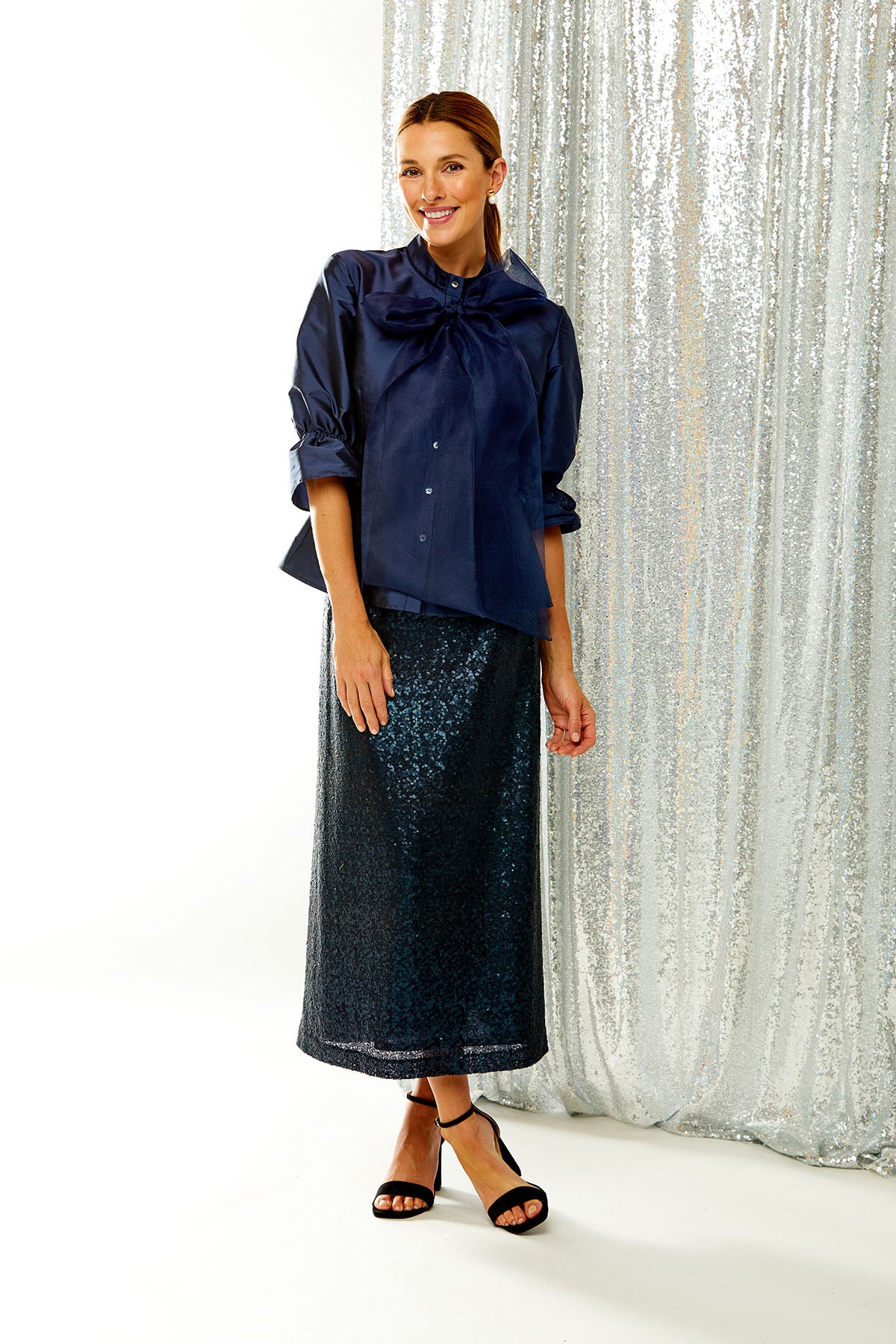 Woman in knit sequin skirt