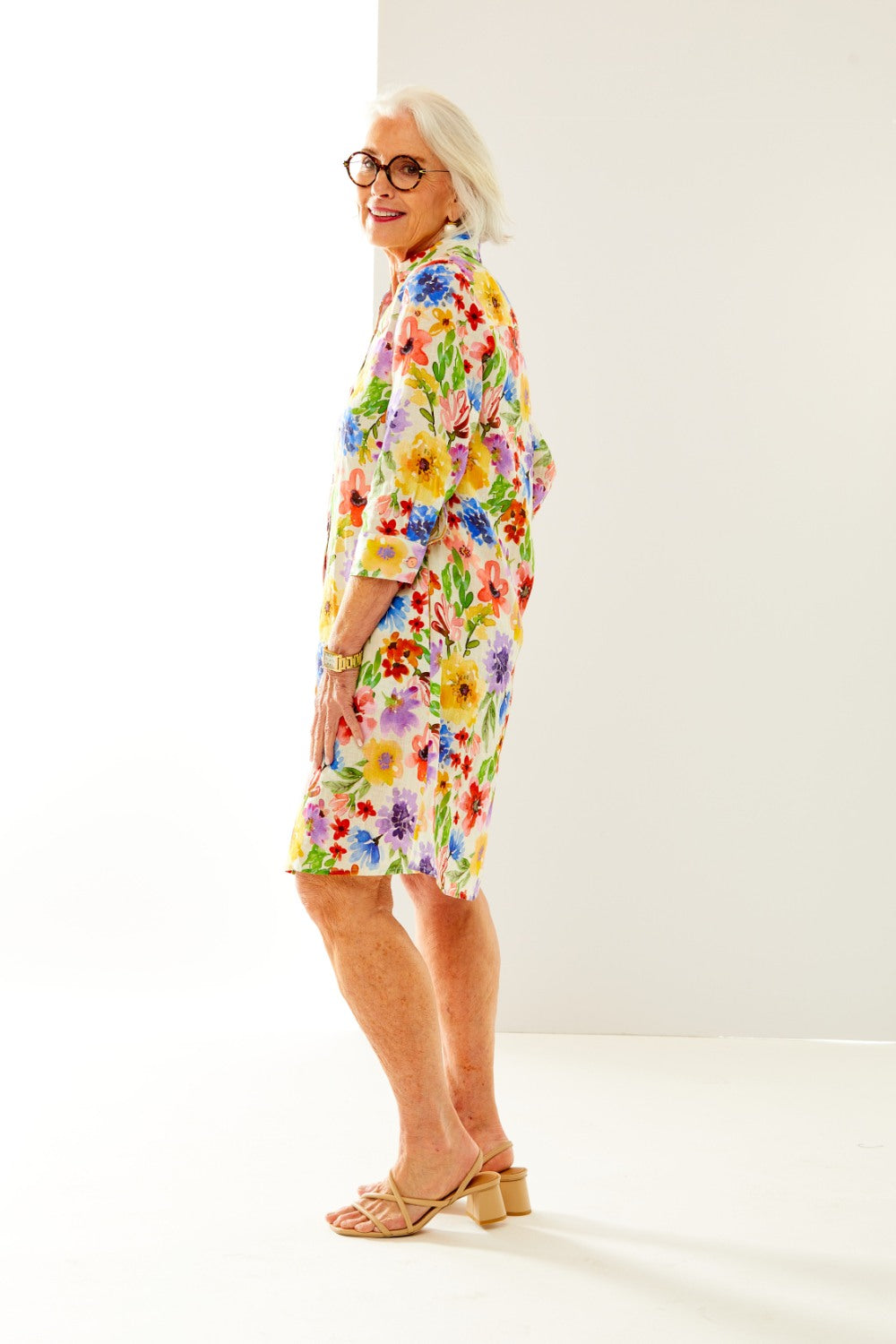 Woman in summer bouquet linen shirtdress