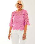 Woman in pink lace top