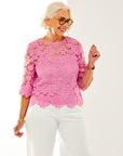 Woman in pink lace top