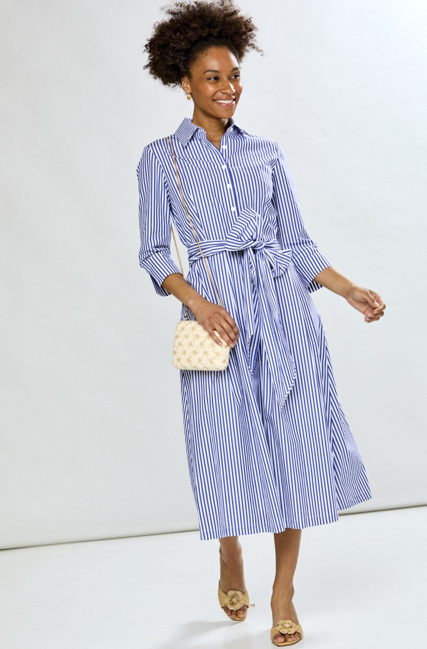 Woman in blue stripe dress