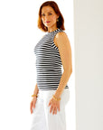 Woman in black/white stripe top