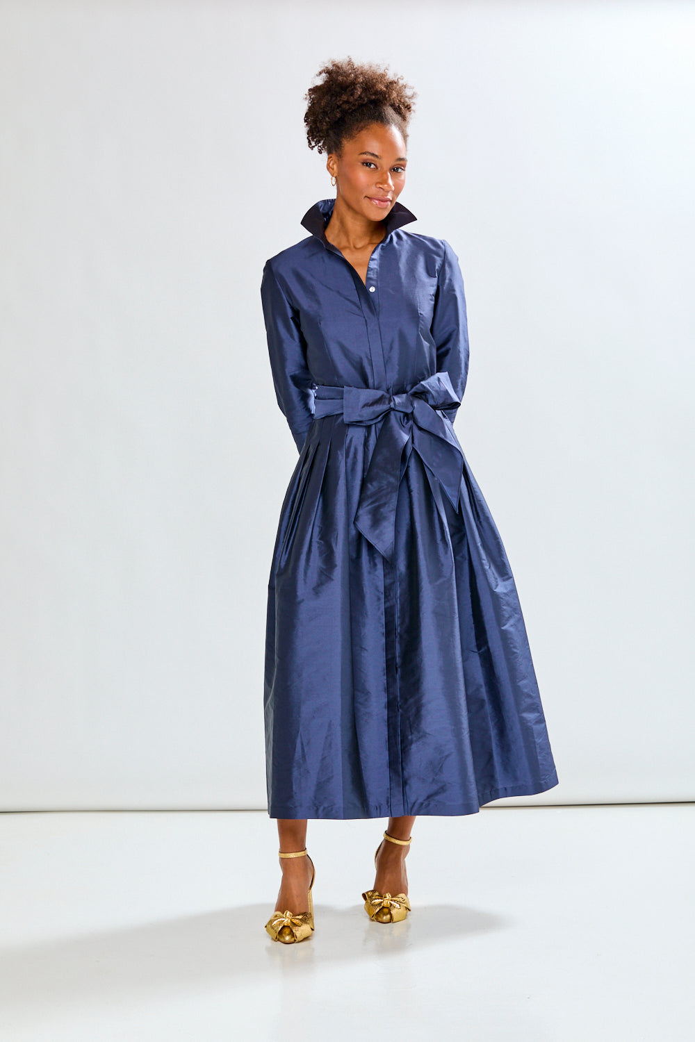 Woman in navy long taffeta dress