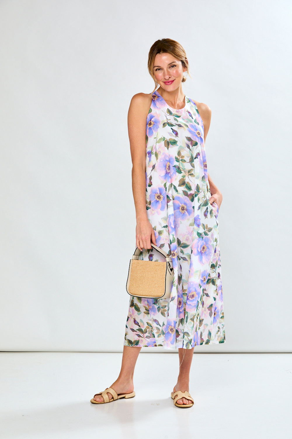 Woman in violet poppies dress