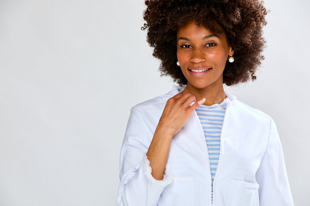 Woman in white fringe jacket