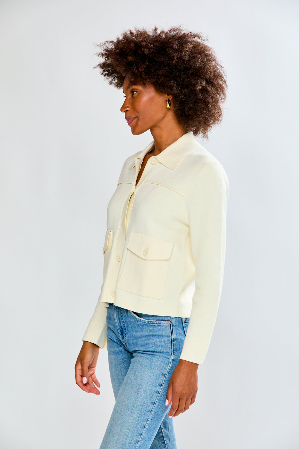 Woman in ivory sweater jacket