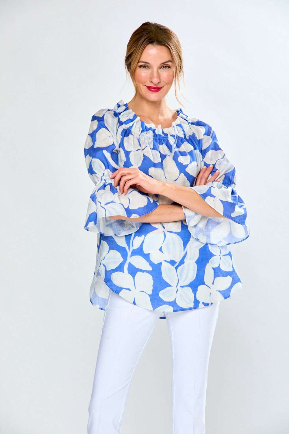 Woman in cobalt leaf print top