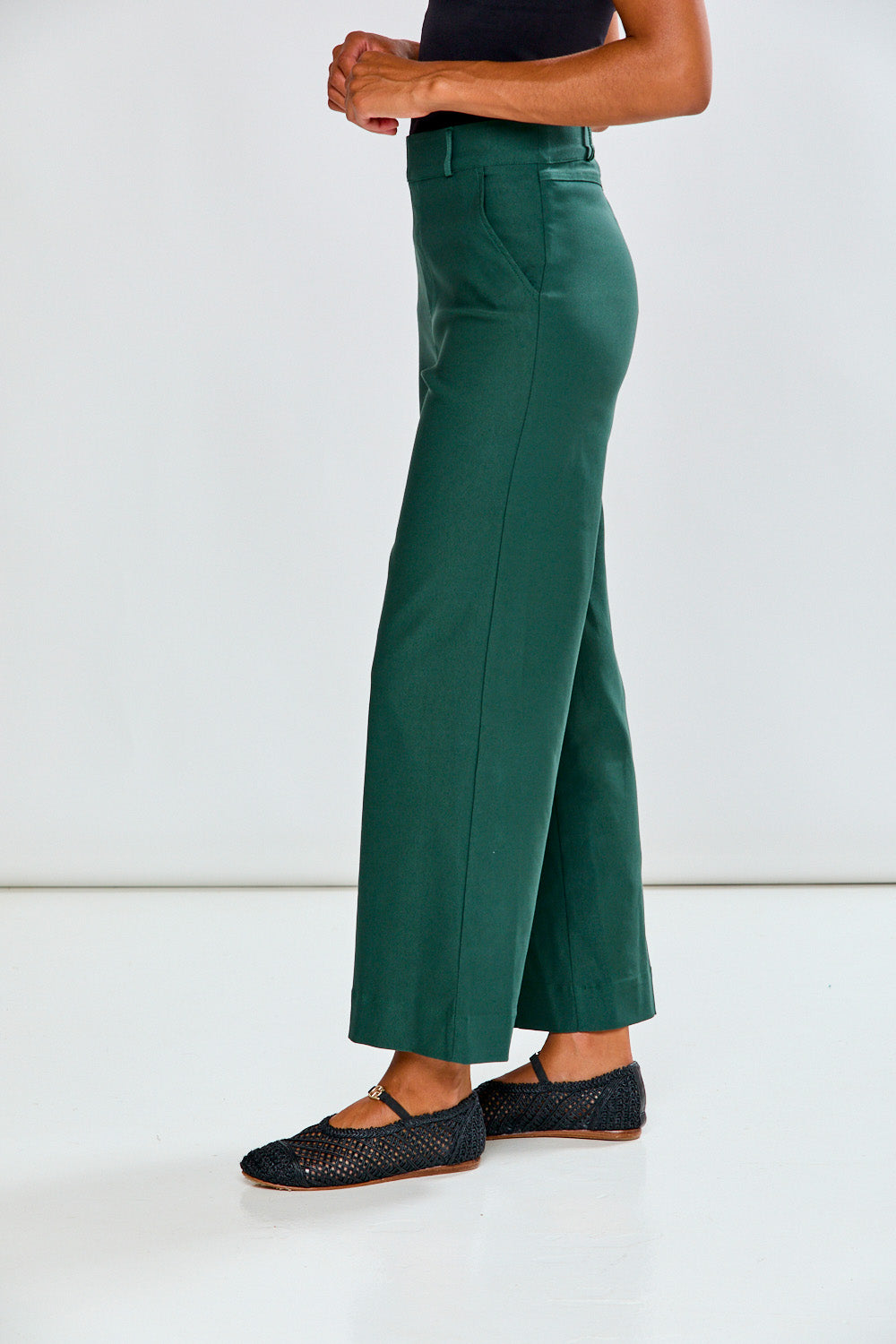 Woman in evergreen wide leg pant