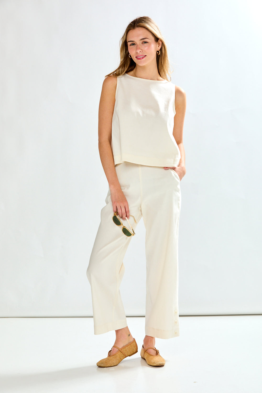 Woman in white top