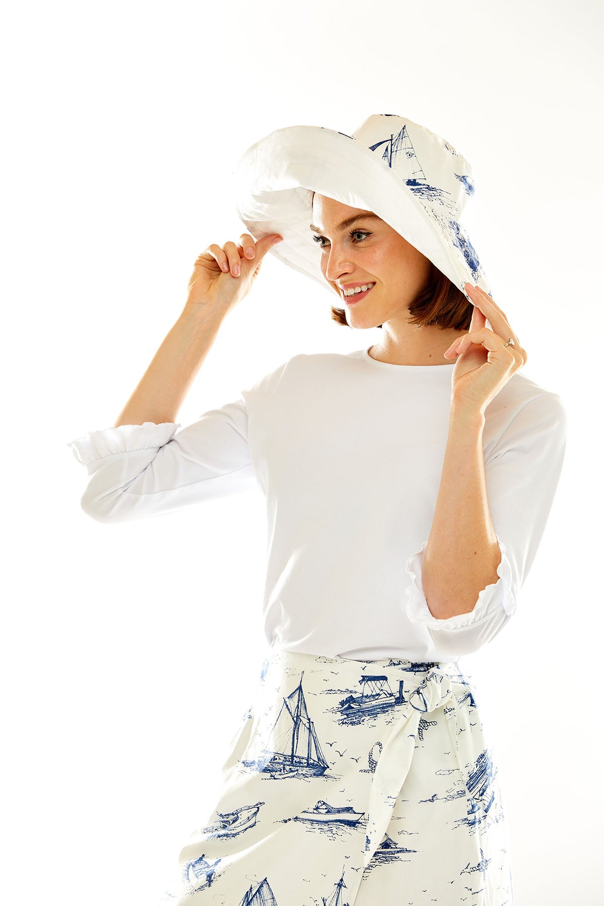 Woman in blue nautical toile hat