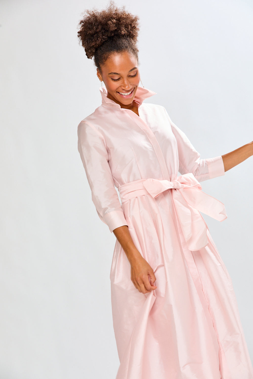Woman in blush pink long taffeta dress