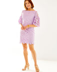 Woman in lilac lace dress