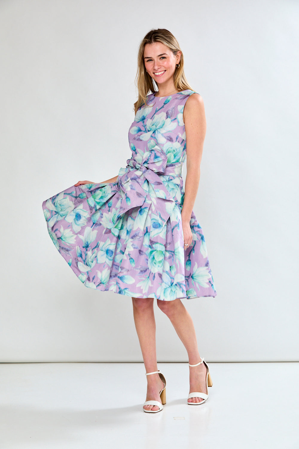 Woman in lilac floral dress