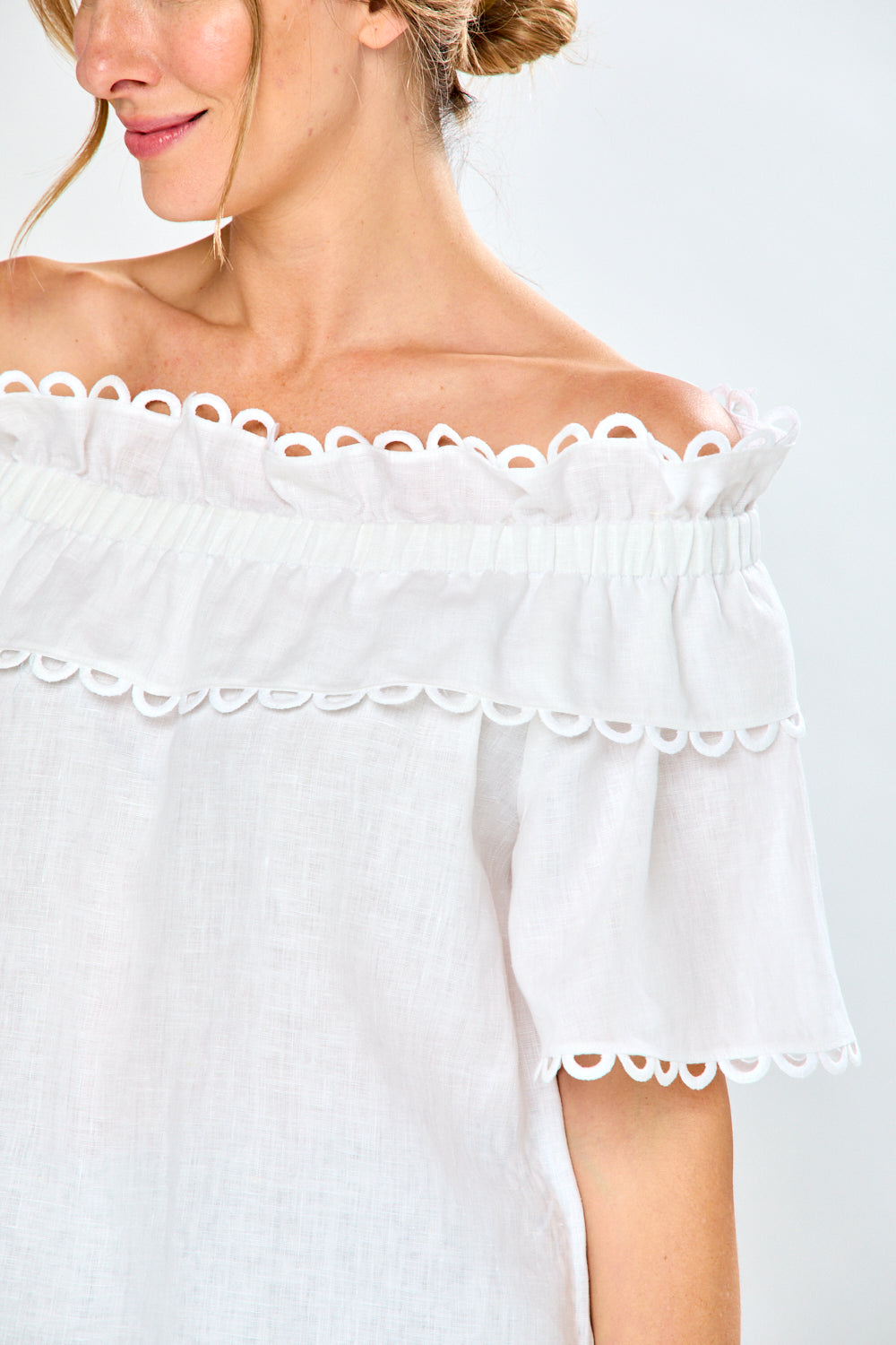 Woman in white linen blouse