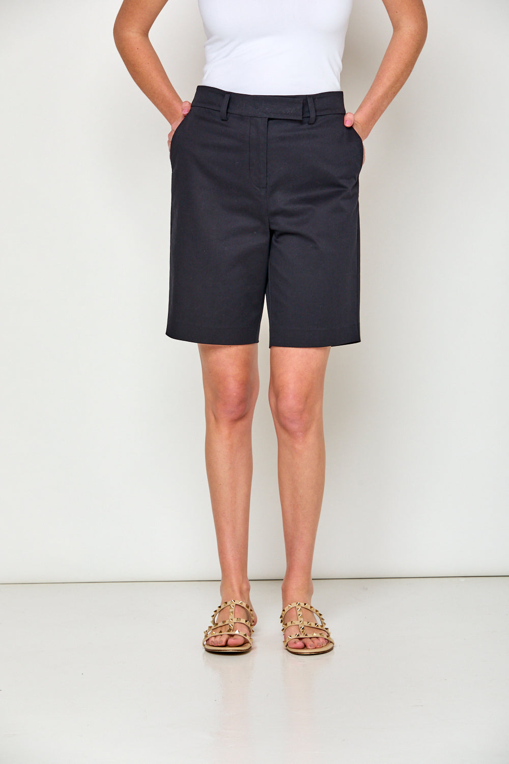 Woman in navy shorts