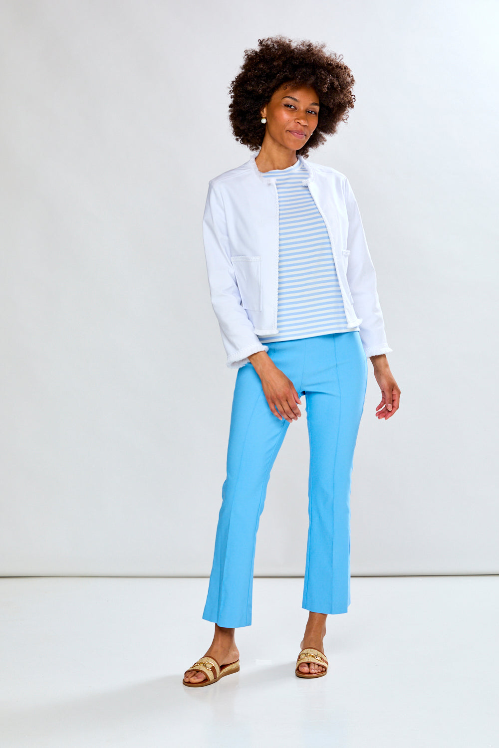 Woman in white fringe jacket