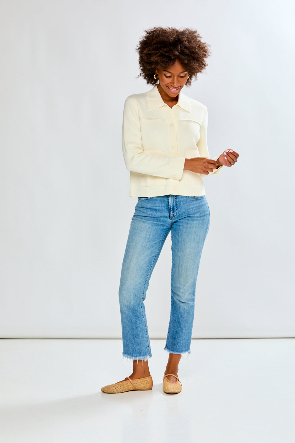 Woman in ivory sweater jacket