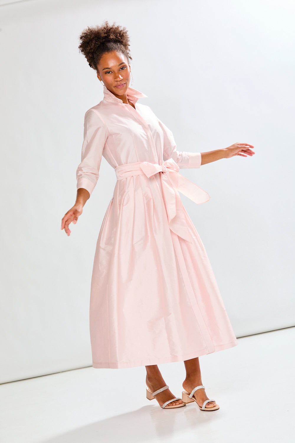 Woman in blush pink long taffeta dress