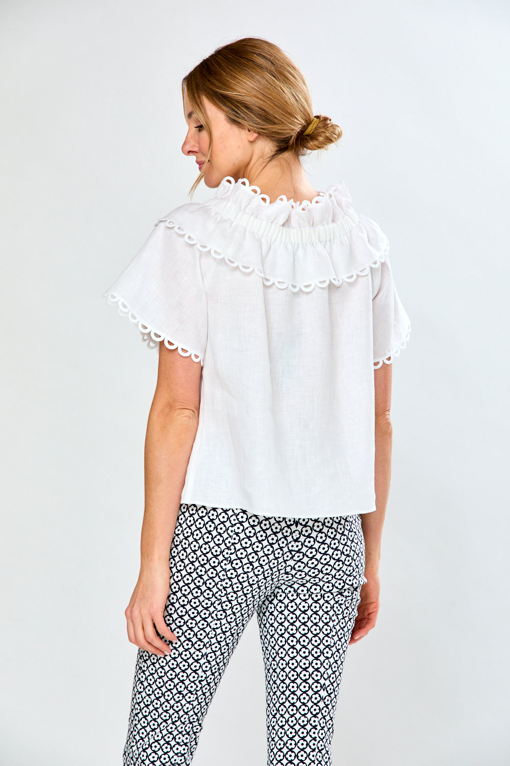 Woman in white linen blouse