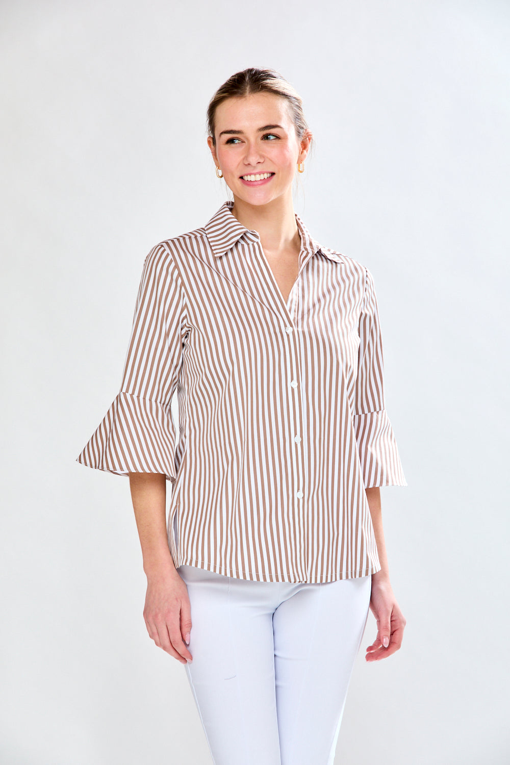 Woman in mocha and white striped top