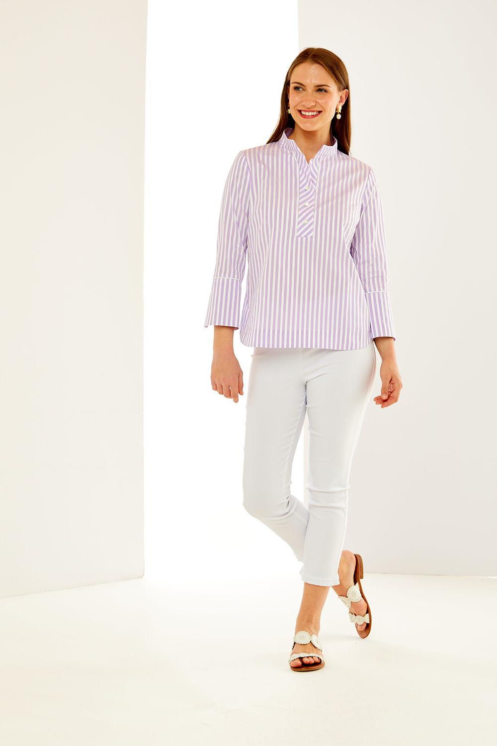 Woman in lilac and white striped top