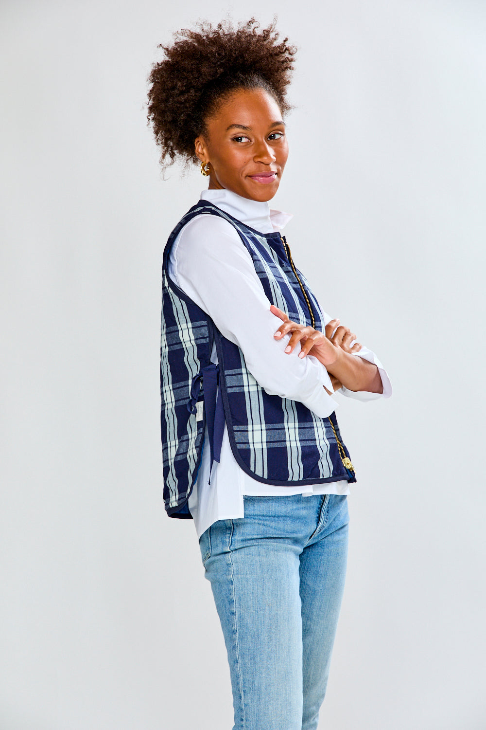 Woman in plaid quilted vest