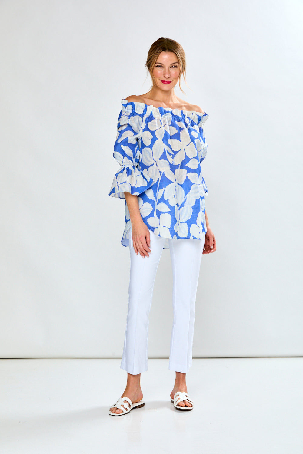 Woman in cobalt leaf print top