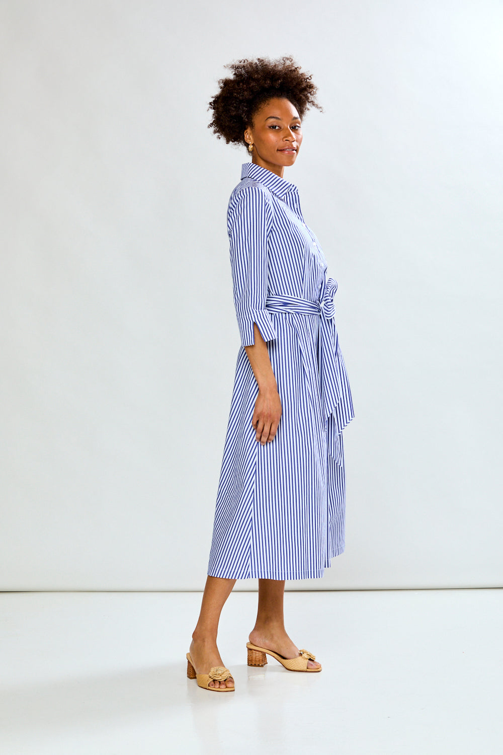 Woman in blue stripe dress