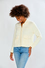 Woman in ivory sweater jacket