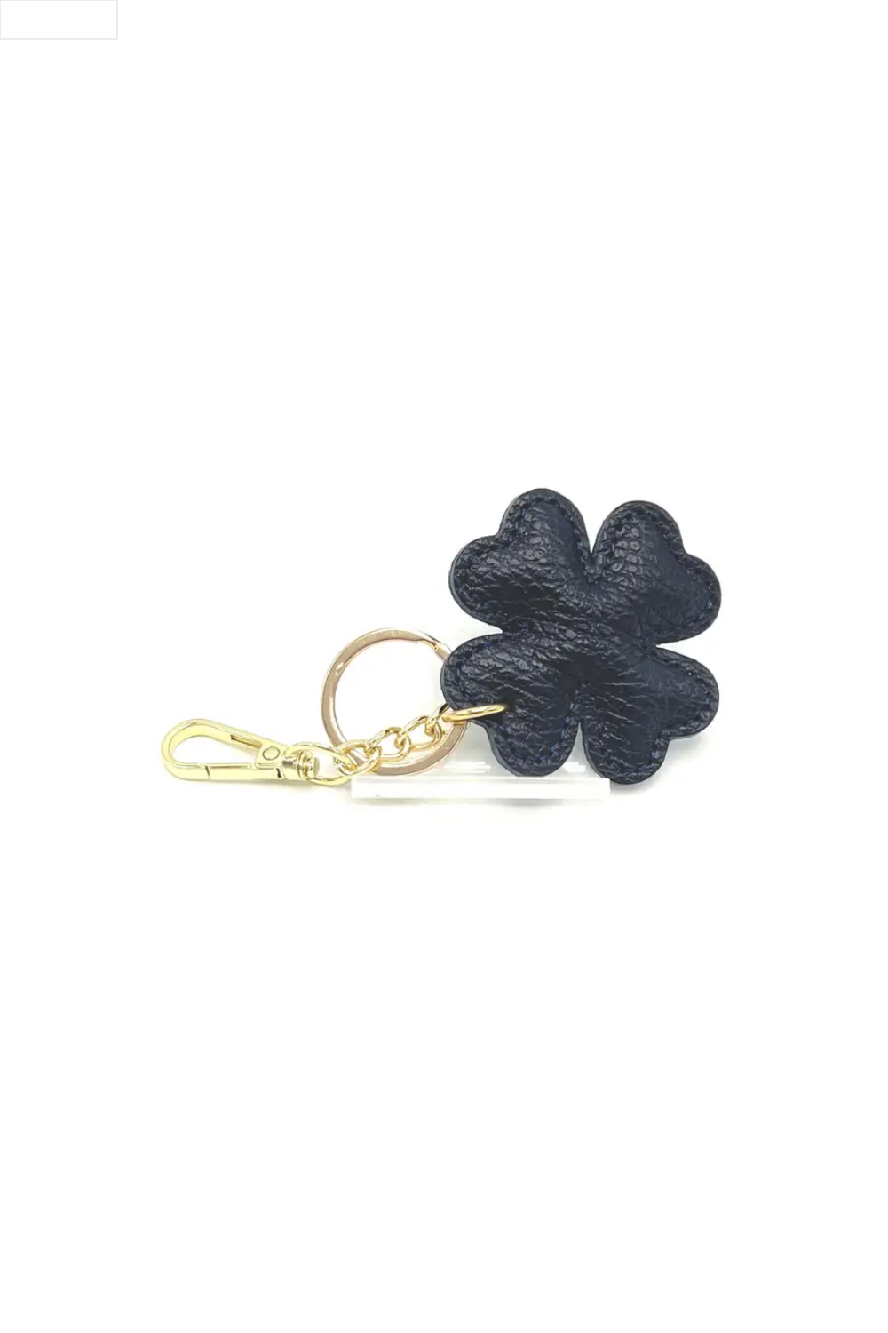Navy four-leaf clover keychain on a white background