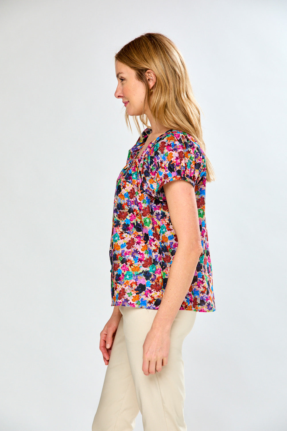 Woman in multi print blouse