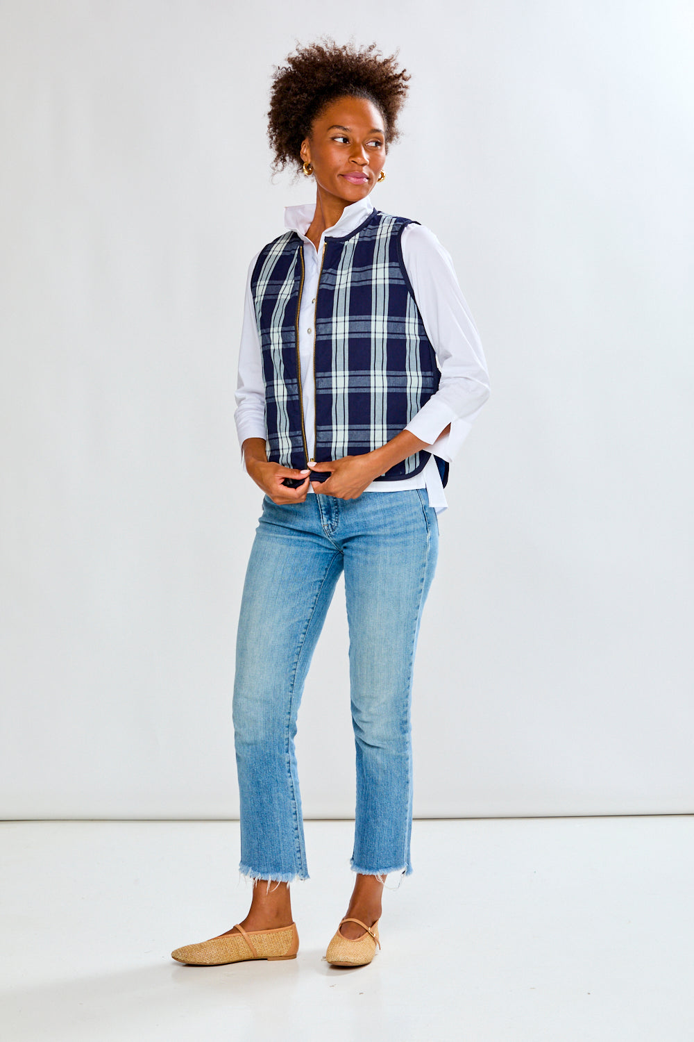 Woman in plaid quilted vest