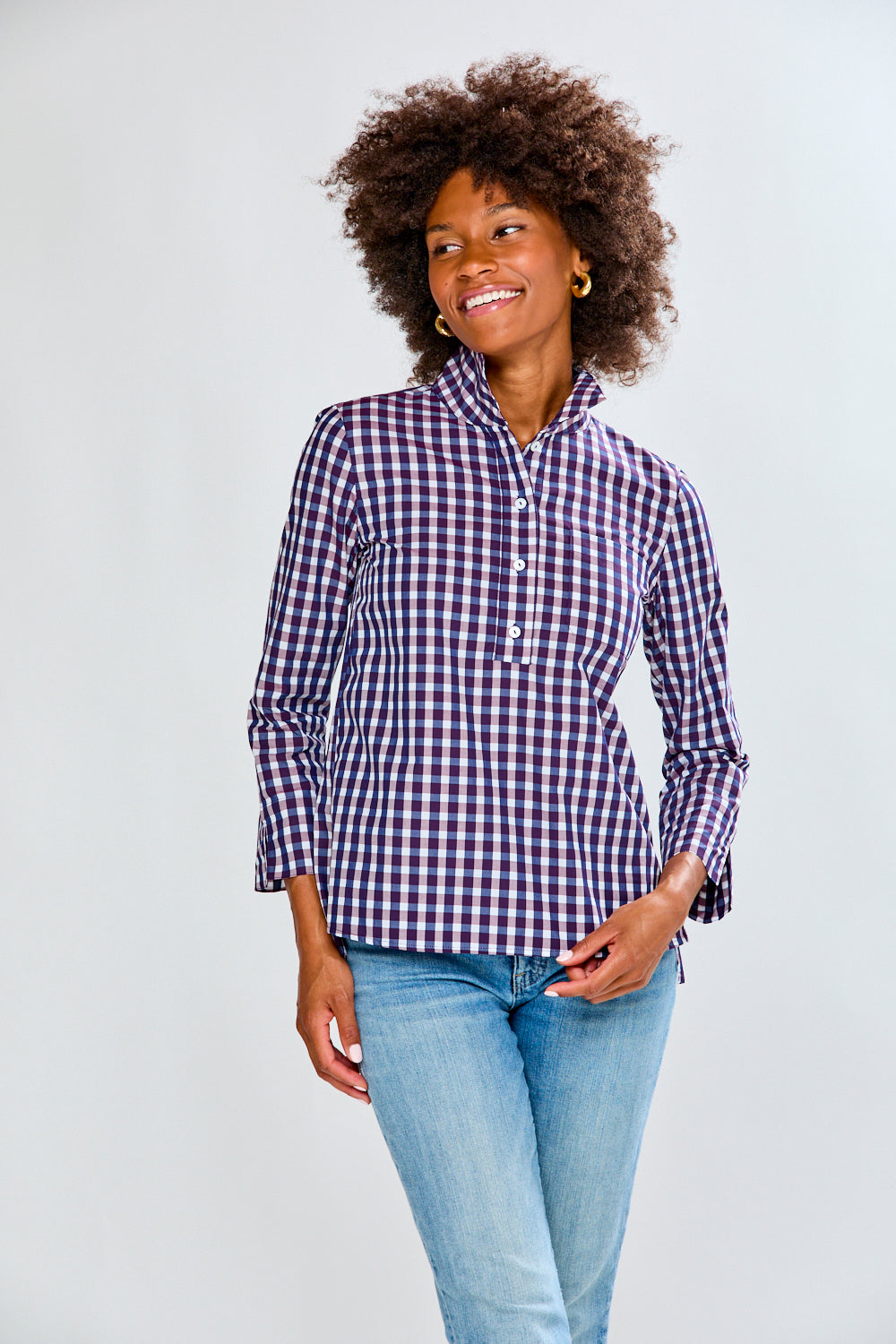 Woman in eggplant/white check top