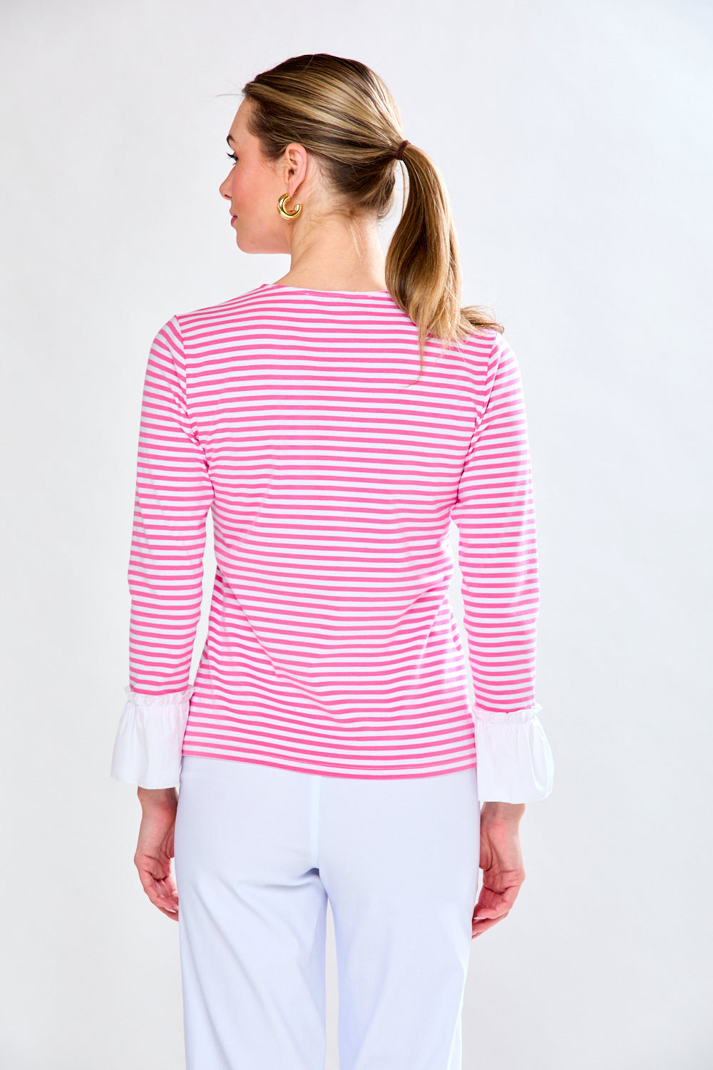 Woman in pink and white stripe top