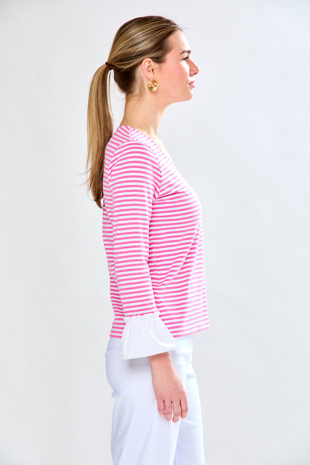 Woman in pink and white stripe top