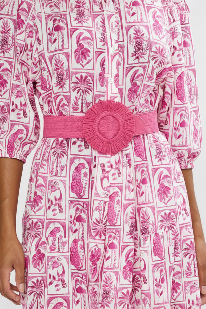 Pink and white patterned dress with a pink belt