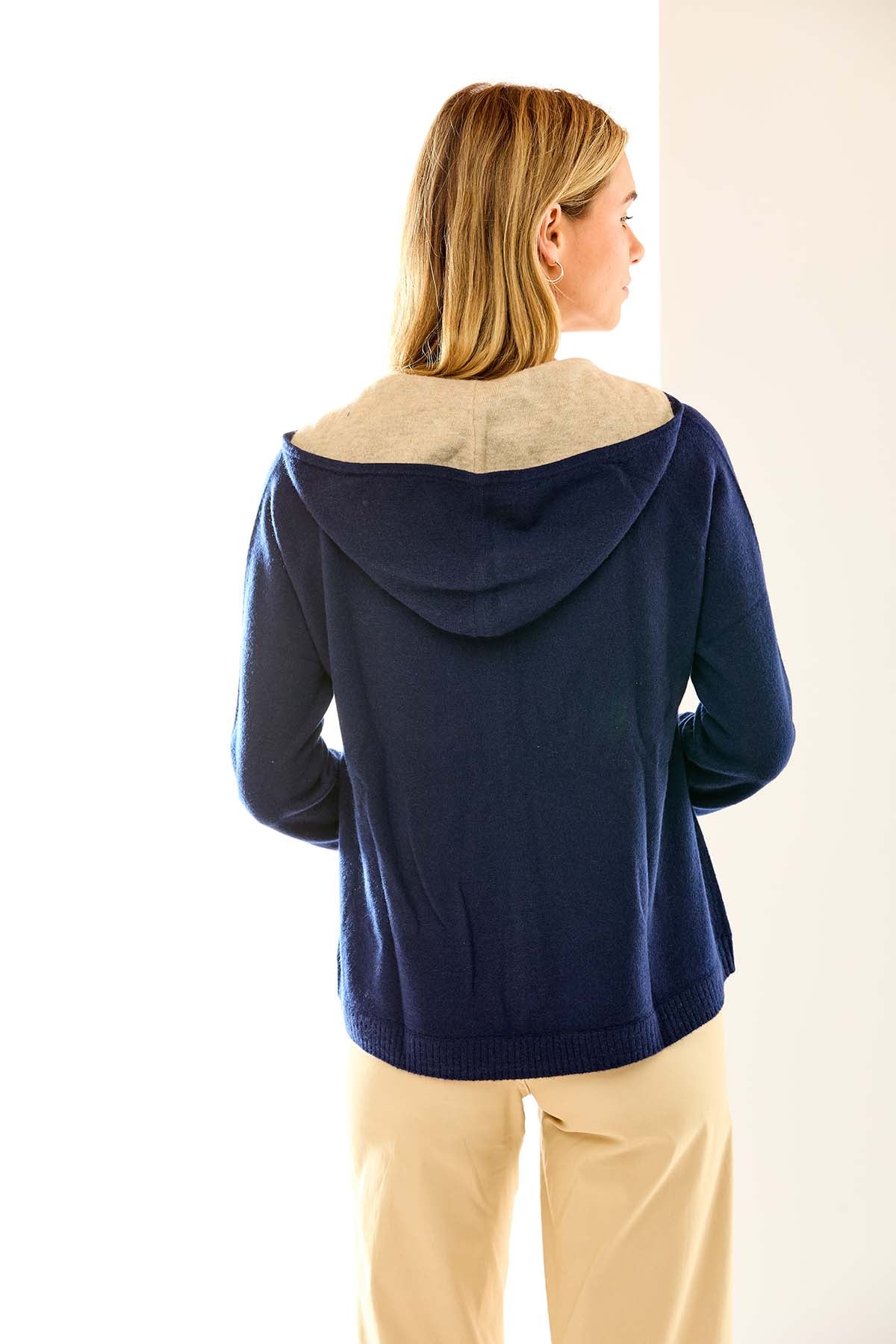Woman in navy cashmere hoodie