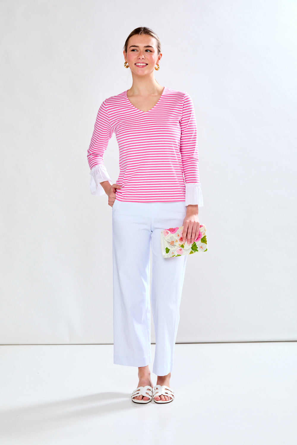 Woman in pink and white stripe top