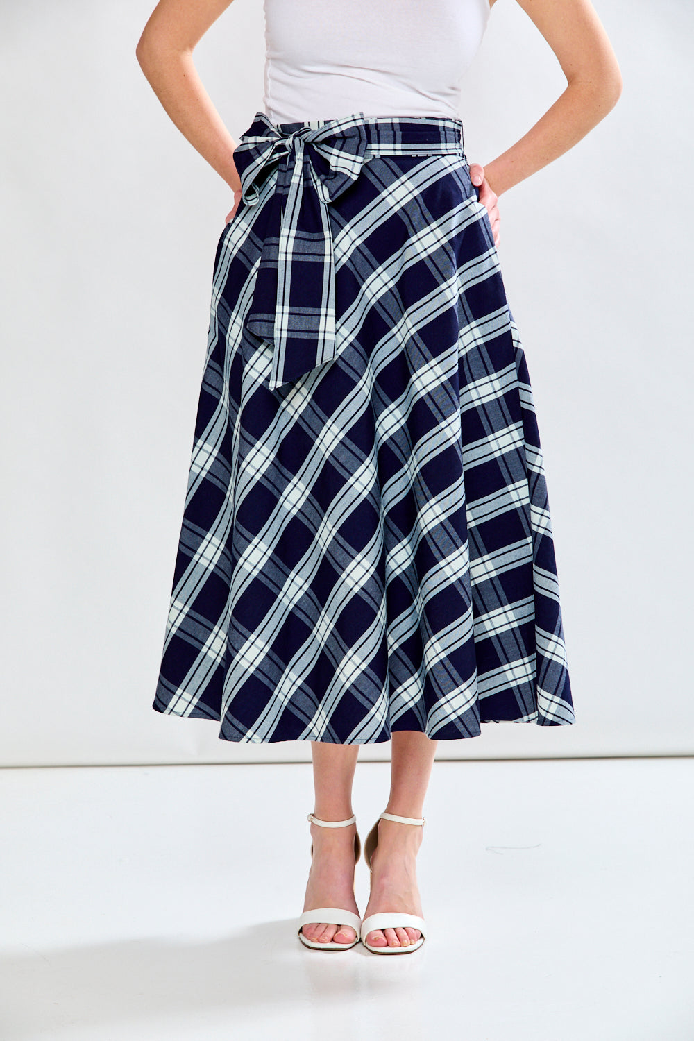 Woman in plaid skirt