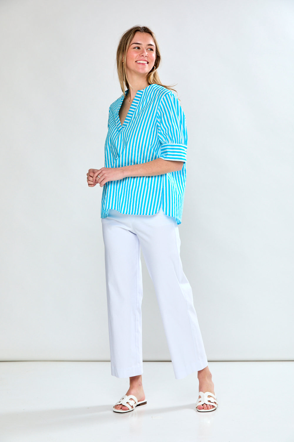 Woman in aqua stripe top