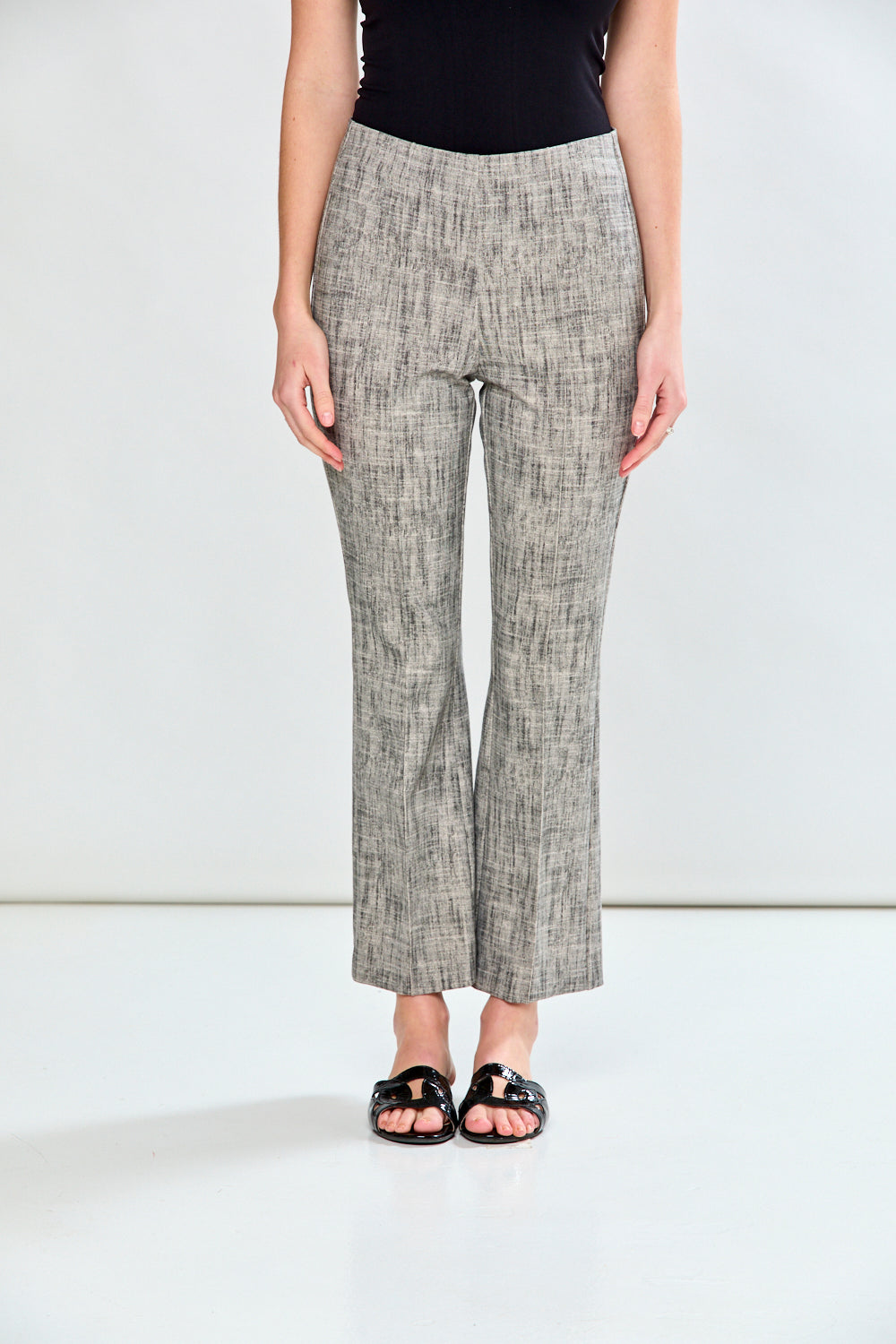 Woman in sand and black pants