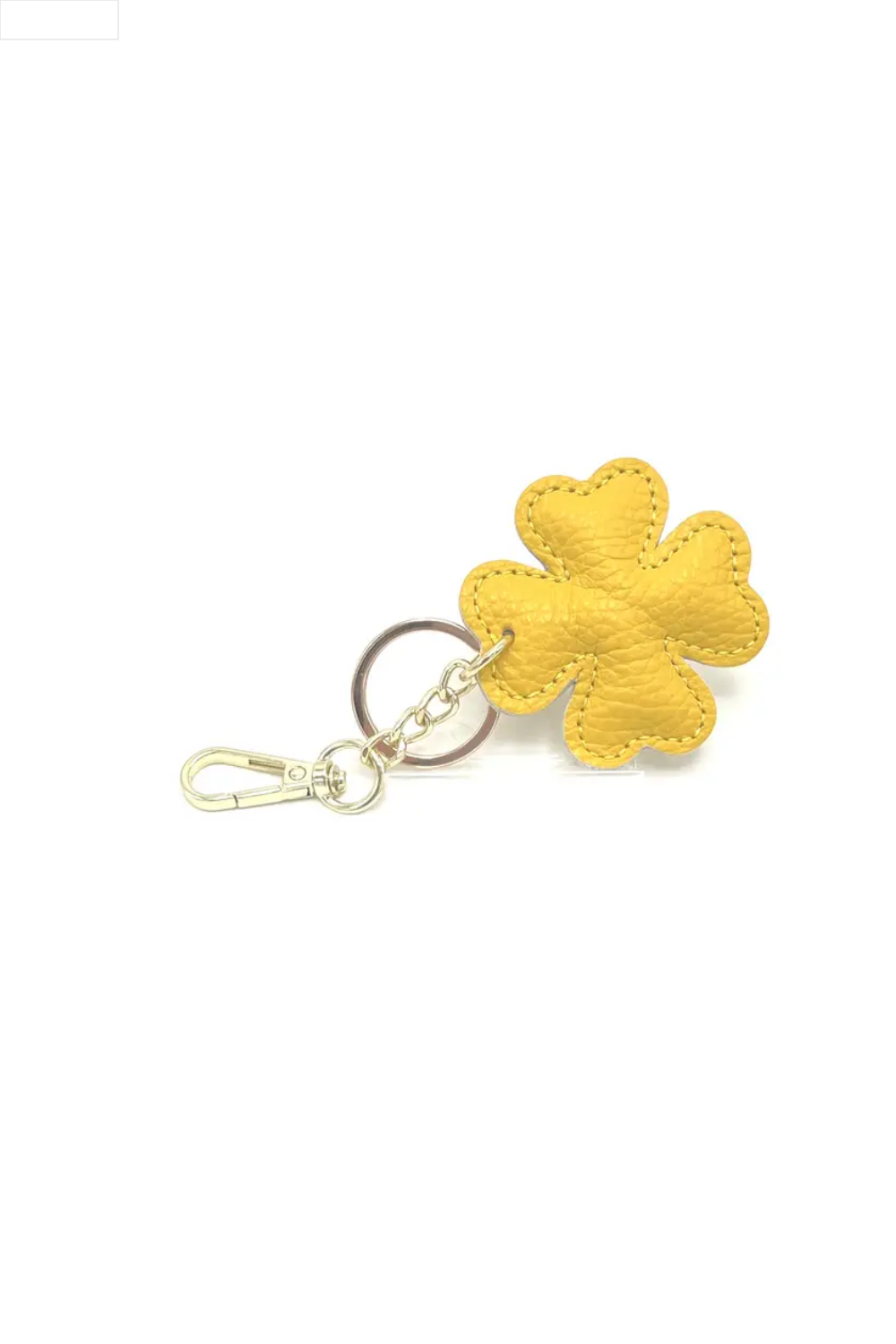 Yellow four-leaf clover keychain on a white background